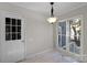 Bright breakfast nook with marble floors, a pendant light, and views of the backyard at 6017 Millbury Ct, Charlotte, NC 28211