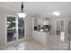 Bright eat-in kitchen area with natural light, granite counters and stainless steel appliances at 6017 Millbury Ct, Charlotte, NC 28211