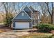 Charming two-story home with a two-car garage and covered front porch in a neighborhood setting at 6017 Millbury Ct, Charlotte, NC 28211