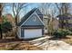 Two-story home featuring gray siding, an attached garage, and a driveway at 6017 Millbury Ct, Charlotte, NC 28211
