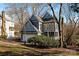 Two-story home featuring gray siding, an attached garage, and a manicured front lawn at 6017 Millbury Ct, Charlotte, NC 28211