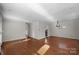 Spacious living room featuring hardwood floors and ample natural light at 6017 Millbury Ct, Charlotte, NC 28211