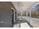 Relaxing screened porch features a ceiling fan and backyard views at 6017 Millbury Ct, Charlotte, NC 28211