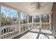 Covered porch with railing offers serene backyard views and shade at 6017 Millbury Ct, Charlotte, NC 28211