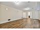 Spacious basement with plank floors, neutral walls, and access to additional rooms at 6921 Thermal Rd, Charlotte, NC 28211