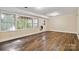 Finished basement featuring plank floors, multiple windows, and backyard access at 6921 Thermal Rd, Charlotte, NC 28211