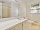 Bathroom with a large mirror, vanity, and a shower with tile surround at 6921 Thermal Rd, Charlotte, NC 28211