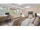Cozy bedroom with natural light, desk, and sitting area at 6921 Thermal Rd, Charlotte, NC 28211