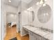 Vanity area with double mirrors and an open doorway to the main bedroom at 705 Torrey Pines Ln, Fort Mill, SC 29715