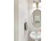 A tidy half bathroom showcasing a pedestal sink, oval mirror, and neat decor at 705 Torrey Pines Ln, Fort Mill, SC 29715