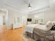 A cozy bedroom boasts a tray ceiling and a large window providing natural light at 705 Torrey Pines Ln, Fort Mill, SC 29715
