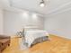 This bedroom features a ceiling fan, tray ceiling, and hardwood floors at 705 Torrey Pines Ln, Fort Mill, SC 29715