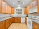 Traditional style kitchen with wood cabinets, granite countertops, and white appliances at 705 Torrey Pines Ln, Fort Mill, SC 29715