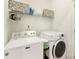 A bright laundry room is equipped with modern appliances and storage at 705 Torrey Pines Ln, Fort Mill, SC 29715