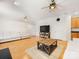Spacious living room with hardwood floors, lots of natural light, and ceiling fans at 705 Torrey Pines Ln, Fort Mill, SC 29715