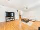 Bright living room with hardwood floors, lots of natural light, and comfortable seating at 705 Torrey Pines Ln, Fort Mill, SC 29715