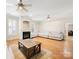 Bright living room with hardwood floors, lots of natural light, fireplace and comfortable seating at 705 Torrey Pines Ln, Fort Mill, SC 29715