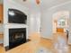 Open living room with fireplace and seamless access to the kitchen at 705 Torrey Pines Ln, Fort Mill, SC 29715