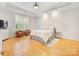 Serene main bedroom suite with hardwood floors, neutral colors, and ample natural light at 705 Torrey Pines Ln, Fort Mill, SC 29715