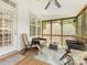 Cozy screened porch with comfortable seating, ideal for enjoying the outdoors in comfort at 705 Torrey Pines Ln, Fort Mill, SC 29715