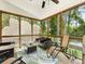 Relaxing screened-in porch with ceiling fan, perfect for outdoor enjoyment and relaxation at 705 Torrey Pines Ln, Fort Mill, SC 29715
