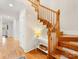 Elegant wooden staircase illuminated by natural light, showcasing the home's interior at 705 Torrey Pines Ln, Fort Mill, SC 29715