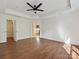 Bedroom featuring trey ceilings, hardwood floors, and ensuite bathroom access at 7309 Rock Hampton Ct, Harrisburg, NC 28075
