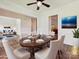Elegant dining room featuring a large table, hardwood floors, and stylish decor at 7309 Rock Hampton Ct, Harrisburg, NC 28075