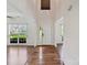 Open foyer with hardwood floors, a front door, and ample natural light at 7309 Rock Hampton Ct, Harrisburg, NC 28075