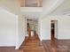 Bright foyer showcasing hardwood floors and a grand staircase at 7309 Rock Hampton Ct, Harrisburg, NC 28075