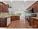 Charming kitchen with wooden cabinets, granite countertops, and stainless steel appliances at 7309 Rock Hampton Ct, Harrisburg, NC 28075