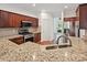 Kitchen boasts granite countertops, stainless steel appliances, and wood cabinetry at 7309 Rock Hampton Ct, Harrisburg, NC 28075