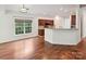 Bright kitchen and dining area with hardwood floors and granite countertops at 7309 Rock Hampton Ct, Harrisburg, NC 28075