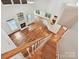 Bright and open living room features hardwood floors, fireplace, and abundant natural light from many windows at 7309 Rock Hampton Ct, Harrisburg, NC 28075