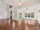 Bright living room featuring soaring ceilings, a fireplace, and sliding glass doors to outdoor deck at 7309 Rock Hampton Ct, Harrisburg, NC 28075