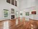 The living room features large windows, a cozy fireplace, and hardwood floors, providing a warm atmosphere at 7309 Rock Hampton Ct, Harrisburg, NC 28075