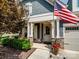 Welcoming front entrance with rocking chairs, stone accents, and beautifully landscaped details at 741 Garrett Green Way # 64, Fort Mill, SC 29715