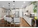 Modern kitchen featuring stainless steel appliances, granite counters, white cabinetry and a wine cooler at 741 Garrett Green Way # 64, Fort Mill, SC 29715