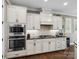 Modern kitchen with stainless steel microwave and oven appliances, gas cooktop, and ample cabinetry at 741 Garrett Green Way # 64, Fort Mill, SC 29715