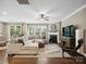 Bright living room featuring a fireplace, large sectional sofa, hardwood floors and neutral decor at 741 Garrett Green Way # 64, Fort Mill, SC 29715