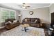 The upstairs living room features hardwood floors, a ceiling fan, and a comfortable seating area at 741 Garrett Green Way # 64, Fort Mill, SC 29715
