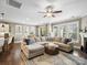 Spacious living room with large windows, a fireplace, and open access to other rooms in the house at 741 Garrett Green Way # 64, Fort Mill, SC 29715