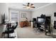 Spacious carpeted office with window, ceiling fan, two desks, and soundproofing at 741 Garrett Green Way # 64, Fort Mill, SC 29715