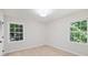 Bright bedroom with hardwood floors and natural light from two windows at 811 Ashmeade Rd, Charlotte, NC 28211