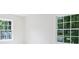 Bright bedroom with two windows offering scenic neighborhood views at 811 Ashmeade Rd, Charlotte, NC 28211