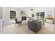 Inviting living room features a white brick fireplace, stylish decor, neutral furniture, and abundant natural light at 811 Ashmeade Rd, Charlotte, NC 28211