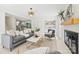 Inviting living room with fireplace, wet bar, neutral tones, and open floor plan seamlessly connecting to the kitchen at 811 Ashmeade Rd, Charlotte, NC 28211