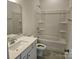 Bright bathroom featuring a vanity with a large mirror and a shower-tub combo with white fixtures at 8231 Annsborough Nw Dr, Concord, NC 28027