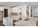 Kitchen featuring white cabinetry, stainless steel appliances, granite countertops, and an island with a sink at 8231 Annsborough Nw Dr, Concord, NC 28027