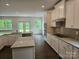 Kitchen featuring stainless steel appliances, an island, granite countertops, and an open floor plan at 8231 Annsborough Nw Dr, Concord, NC 28027